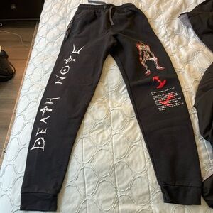 Black Graphic Sweatpants with Red and White Designs